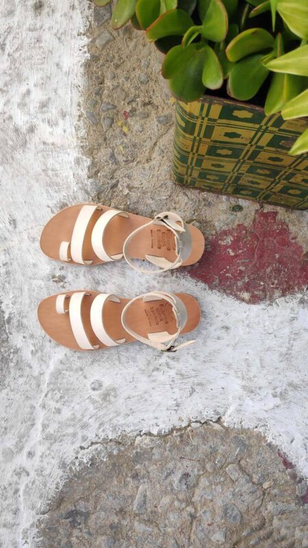 White leather dressy sandals with two straps, toe ring and high ankle strap, top view