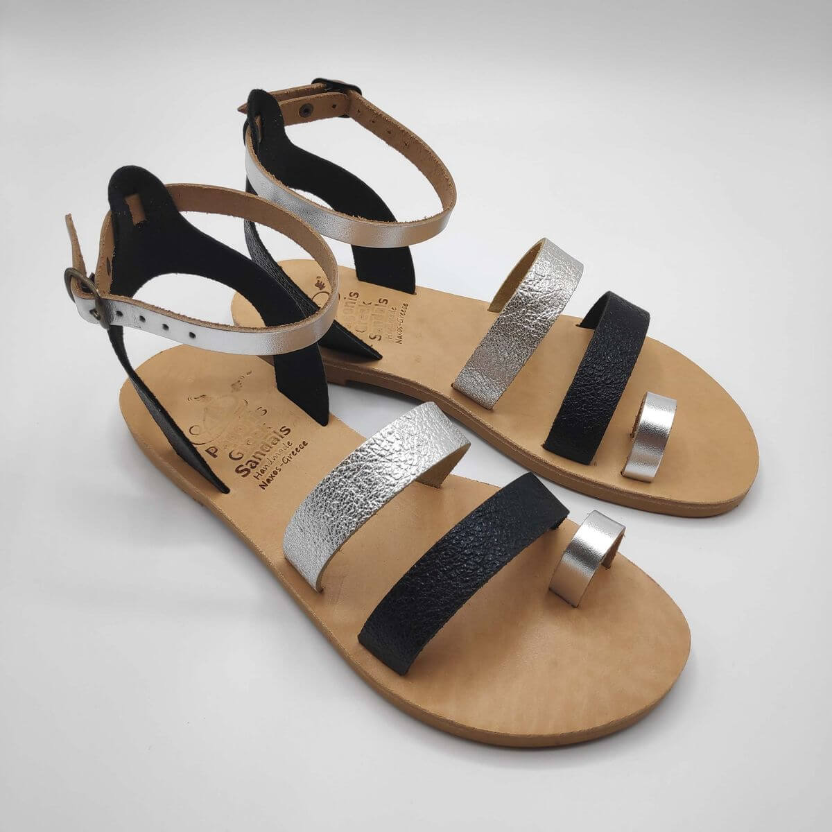 Black Silver leather dressy sandals with two straps, toe ring and high ankle strap, side view