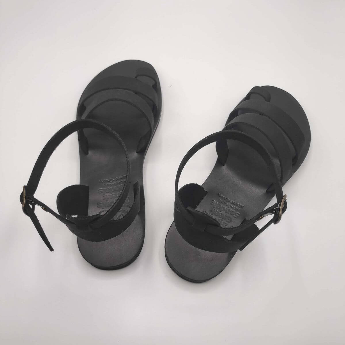 Black Nubuck leather dressy sandals with two straps, toe ring and high ankle strap, back view