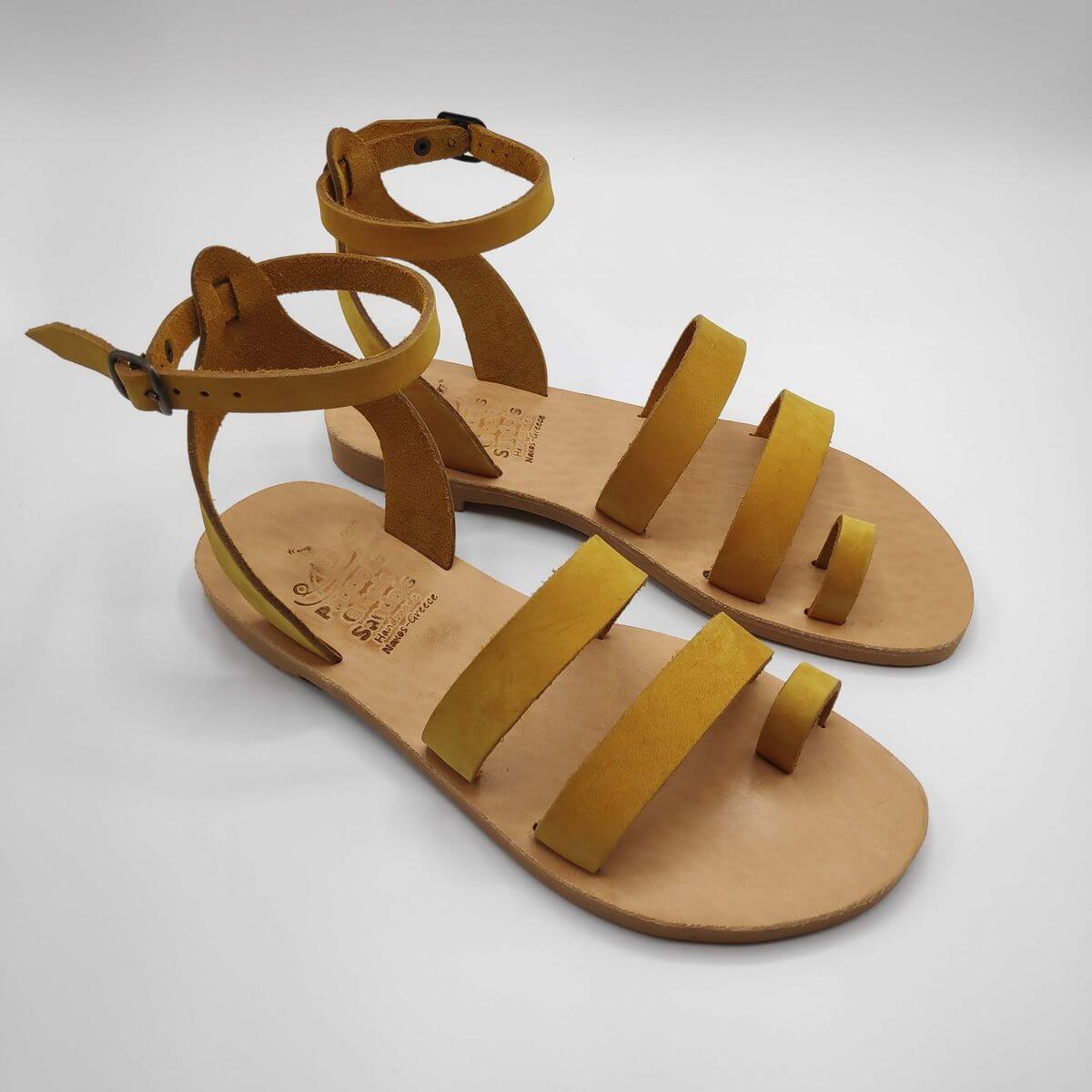 Yellow nubuck leather dressy sandals with two straps, toe ring and high ankle strap, side view